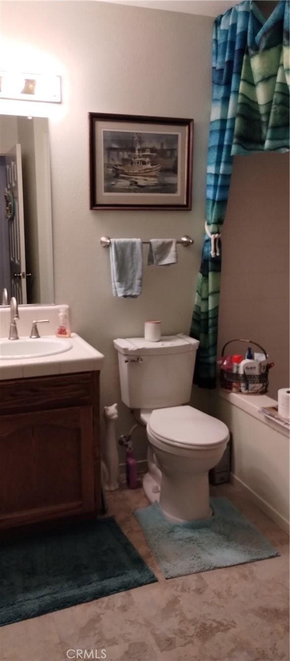 full bathroom featuring vanity and toilet