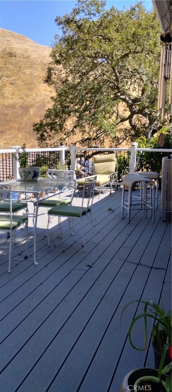 wooden terrace with a mountain view