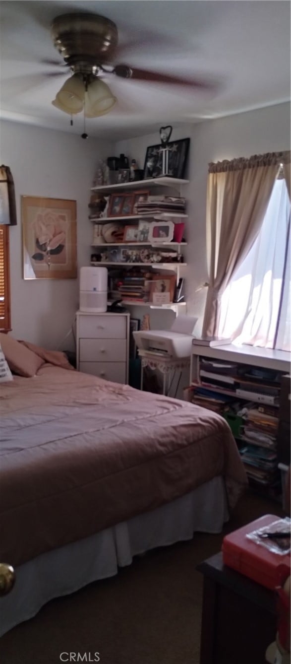 bedroom featuring ceiling fan