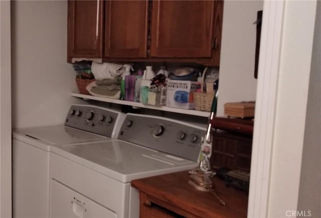 laundry area with cabinet space and washer and clothes dryer