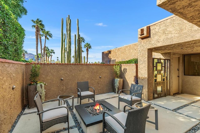 view of patio / terrace with a fire pit