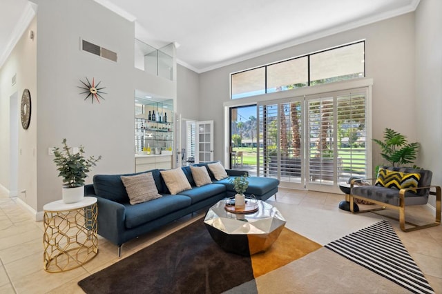 living room featuring a towering ceiling, crown molding, bar area, and light tile patterned flooring