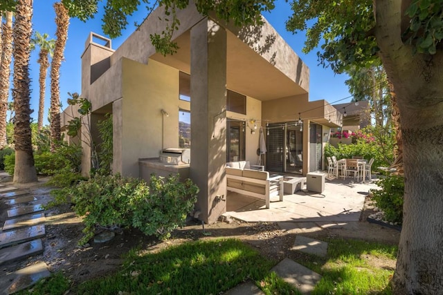 rear view of house with a patio area