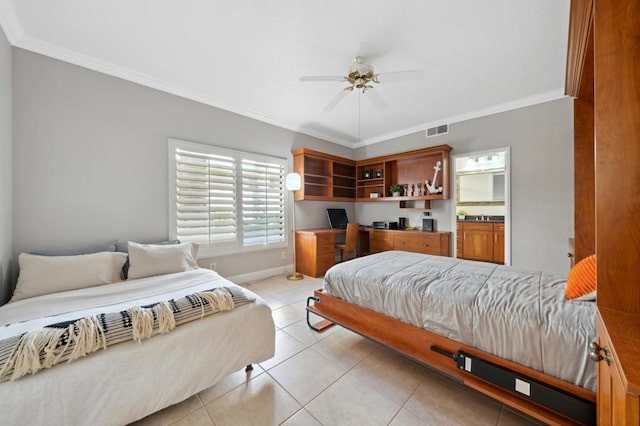 tiled bedroom with built in desk, ceiling fan, and ornamental molding