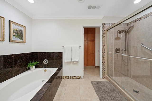 bathroom featuring independent shower and bath, ornamental molding, and tile patterned flooring