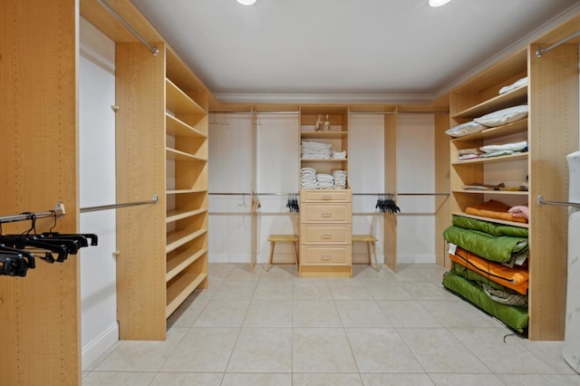 spacious closet featuring light tile patterned floors