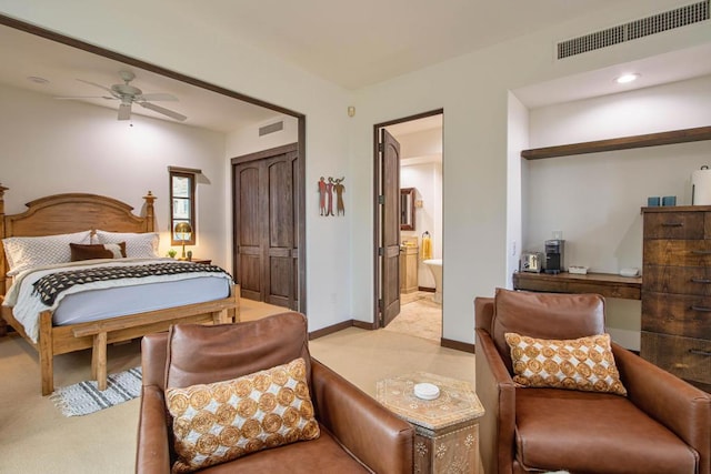 carpeted bedroom featuring ensuite bathroom and ceiling fan