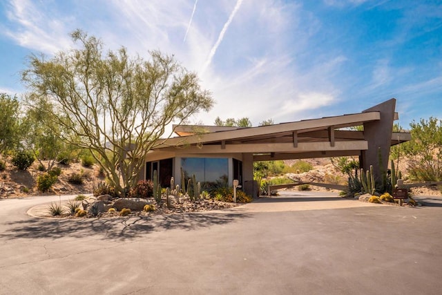 exterior space featuring a carport