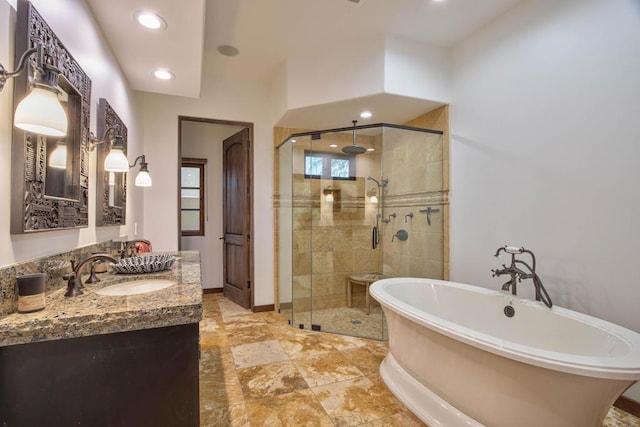 bathroom featuring vanity and separate shower and tub