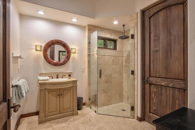 bathroom with vanity and an enclosed shower