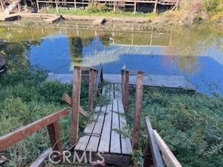 view of dock with a water view