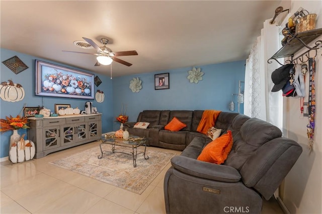 tiled living room with ceiling fan