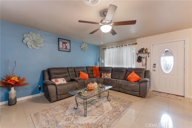 tiled living room featuring ceiling fan