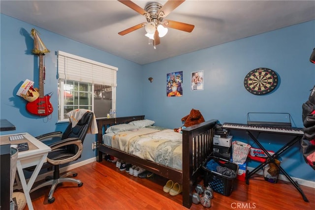 bedroom featuring ceiling fan and wood-type flooring