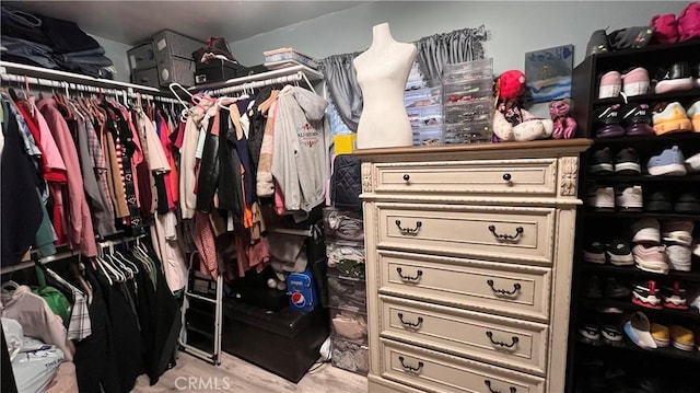 walk in closet featuring light hardwood / wood-style floors