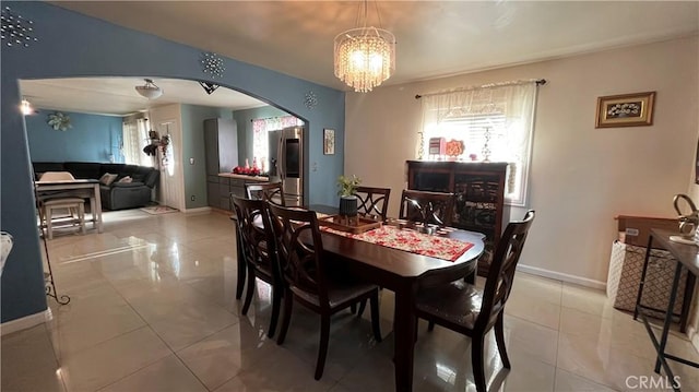 dining space featuring a chandelier