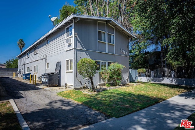 view of home's exterior featuring a lawn