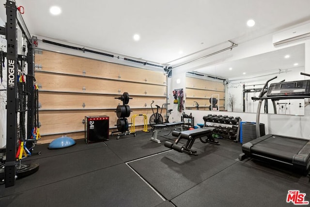 workout area featuring a wall unit AC