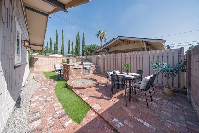 view of patio / terrace featuring area for grilling and a grill