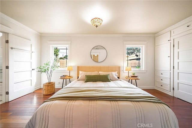 bedroom featuring ornamental molding and dark hardwood / wood-style flooring