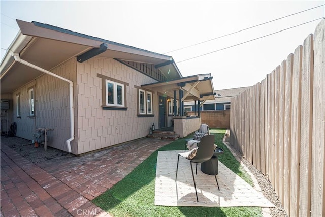 view of side of home featuring a patio