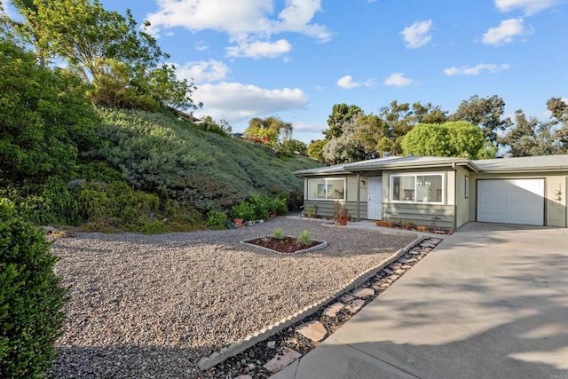 ranch-style house featuring a garage