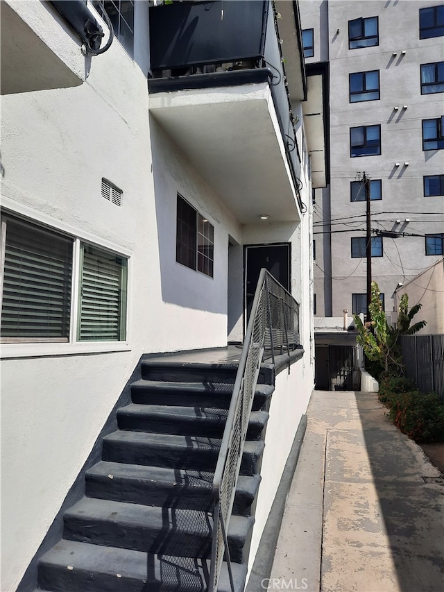 entrance to property with a balcony