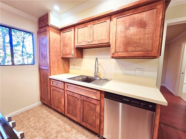 kitchen with dishwasher, light tile patterned flooring, ornamental molding, and sink