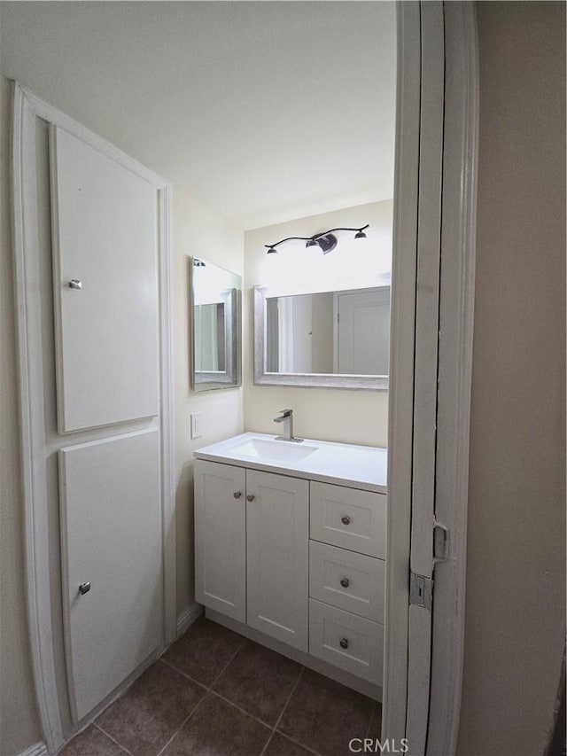 bathroom featuring tile patterned flooring and vanity