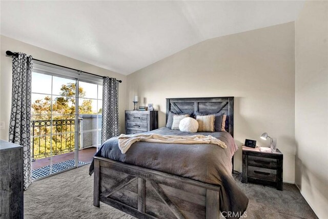 bedroom with access to outside, carpet flooring, and lofted ceiling