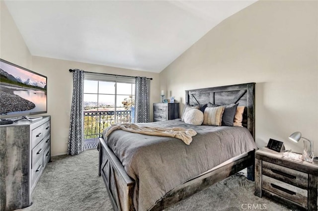 carpeted bedroom featuring access to outside and vaulted ceiling