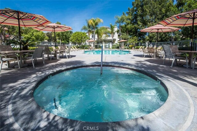 view of swimming pool featuring a patio area