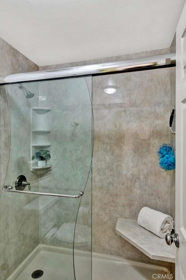 bathroom featuring walk in shower