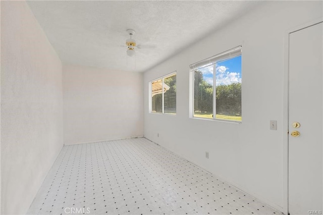 spare room with ceiling fan