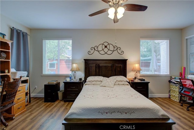 bedroom featuring hardwood / wood-style floors and ceiling fan