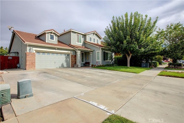 front of property with a garage and a front yard