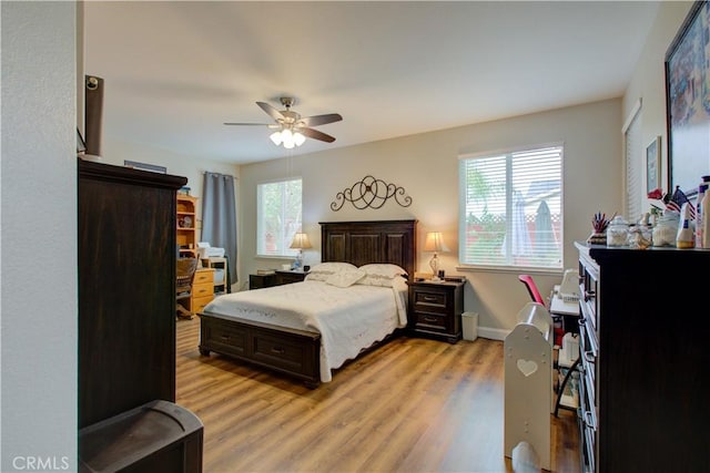 bedroom featuring ceiling fan and light wood-type flooring