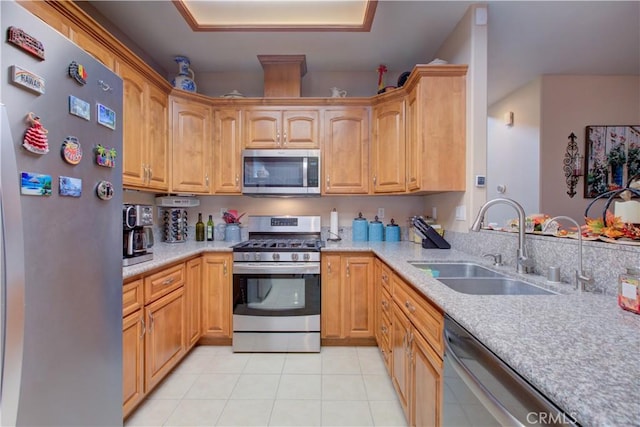 kitchen featuring sink, light tile patterned flooring, and appliances with stainless steel finishes