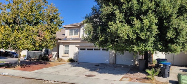 obstructed view of property with a garage