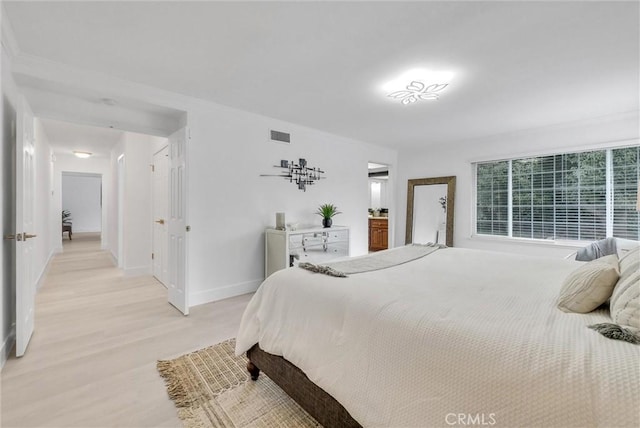 bedroom featuring light hardwood / wood-style flooring