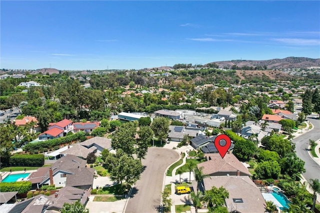 birds eye view of property with a mountain view