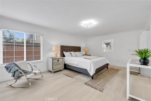 bedroom with light hardwood / wood-style flooring