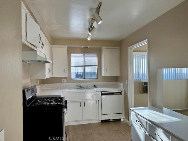 kitchen featuring dishwasher, white cabinets, and stainless steel gas stove