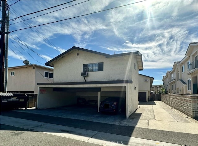 back of house featuring a garage