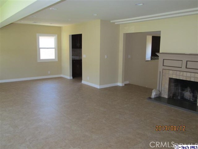 unfurnished living room with a fireplace