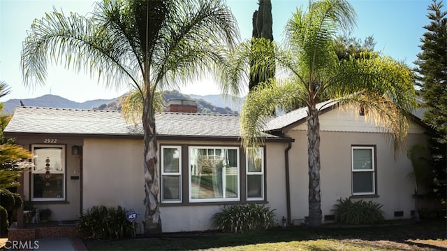 view of home's exterior with a mountain view