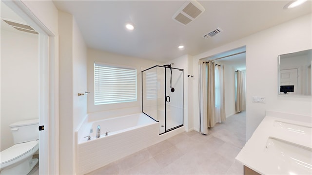 full bathroom featuring shower with separate bathtub, tile patterned floors, vanity, and toilet