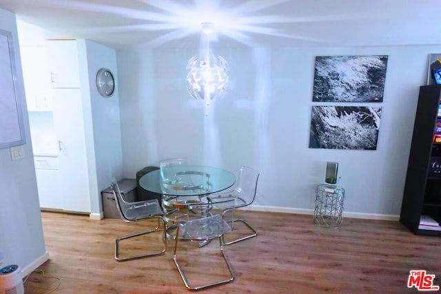 dining room with hardwood / wood-style floors