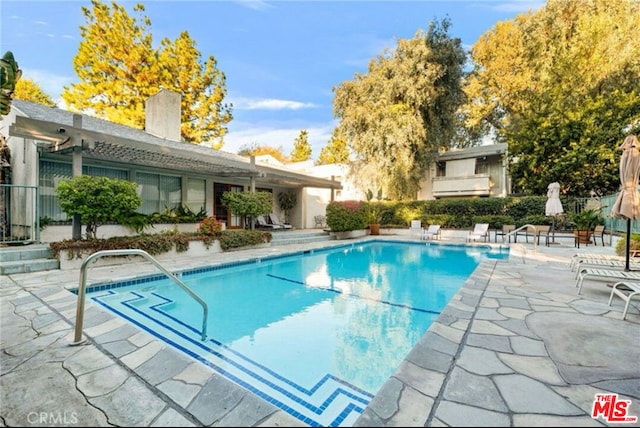 view of pool with a patio area