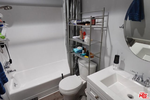 full bathroom featuring vanity, wood-type flooring,  shower combination, and toilet